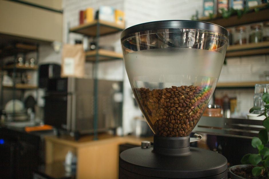 Close-up of coffee beans in a grinder at a cozy café in Eskişehir, Turkey.